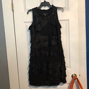 Black ruffle party dress by S.L. Fashions